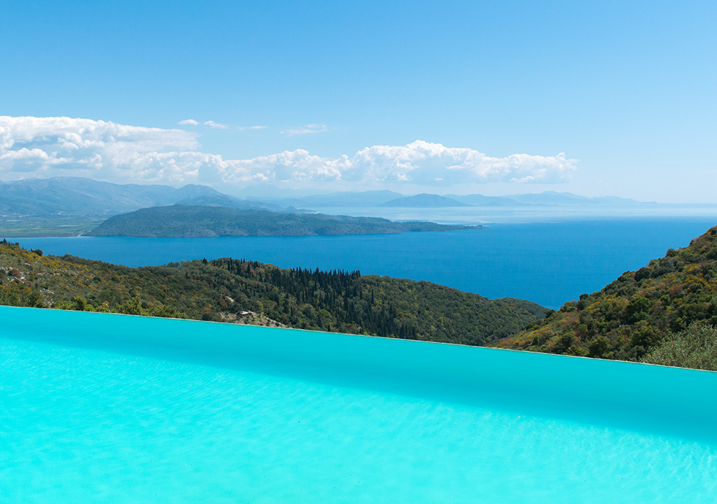 Rou Estate greece view of the sea and the turqoise waters of the pool